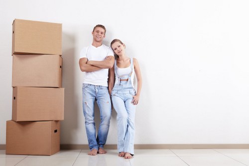 Flat removals in Ruislip with a moving team packing boxes