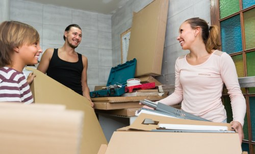 Local Ruislip movers handling household furniture with protective wrapping