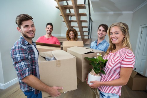 Packed boxes and furniture prepared for loading into a removals van