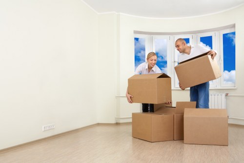 Packed moving boxes and furniture in a Ruislip home