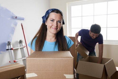 Local moving team handling fragile belongings during packing in Ruislip