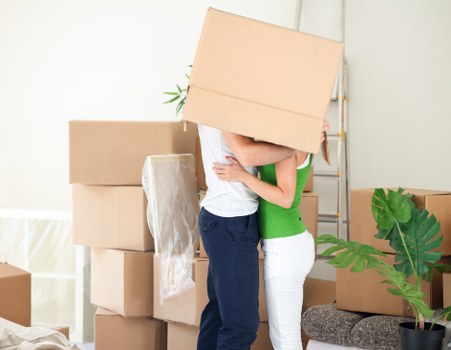 Furniture and boxes being loaded into a moving truck in Ruislip
