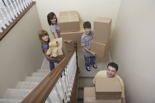 Professional man with van service handling boxes in Ruislip